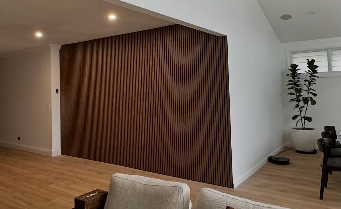 Dark timber slat feature wall — custom joinery
