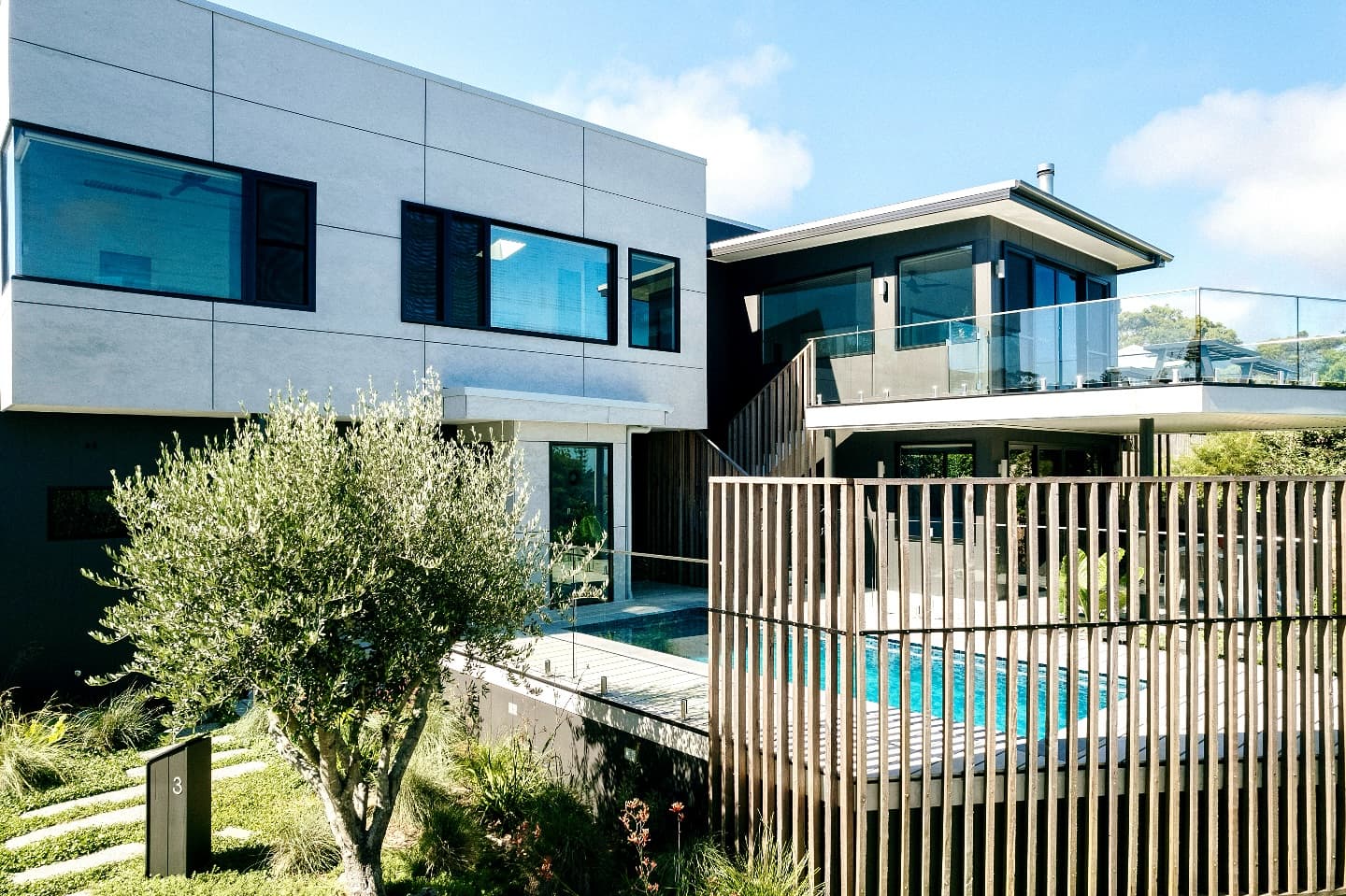 Modern two-storey home exterior with pool