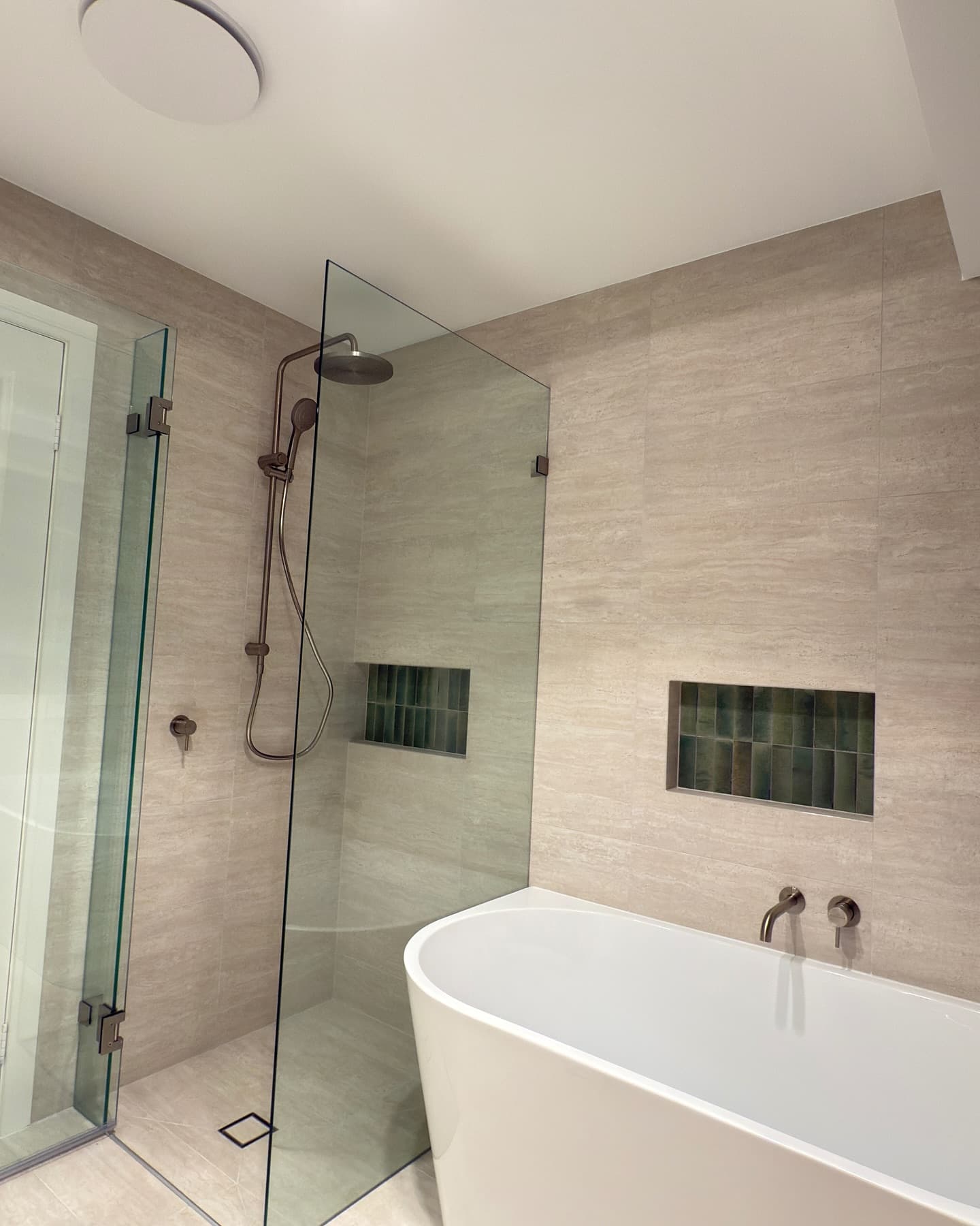 Ensuite — freestanding bath and frameless glass shower